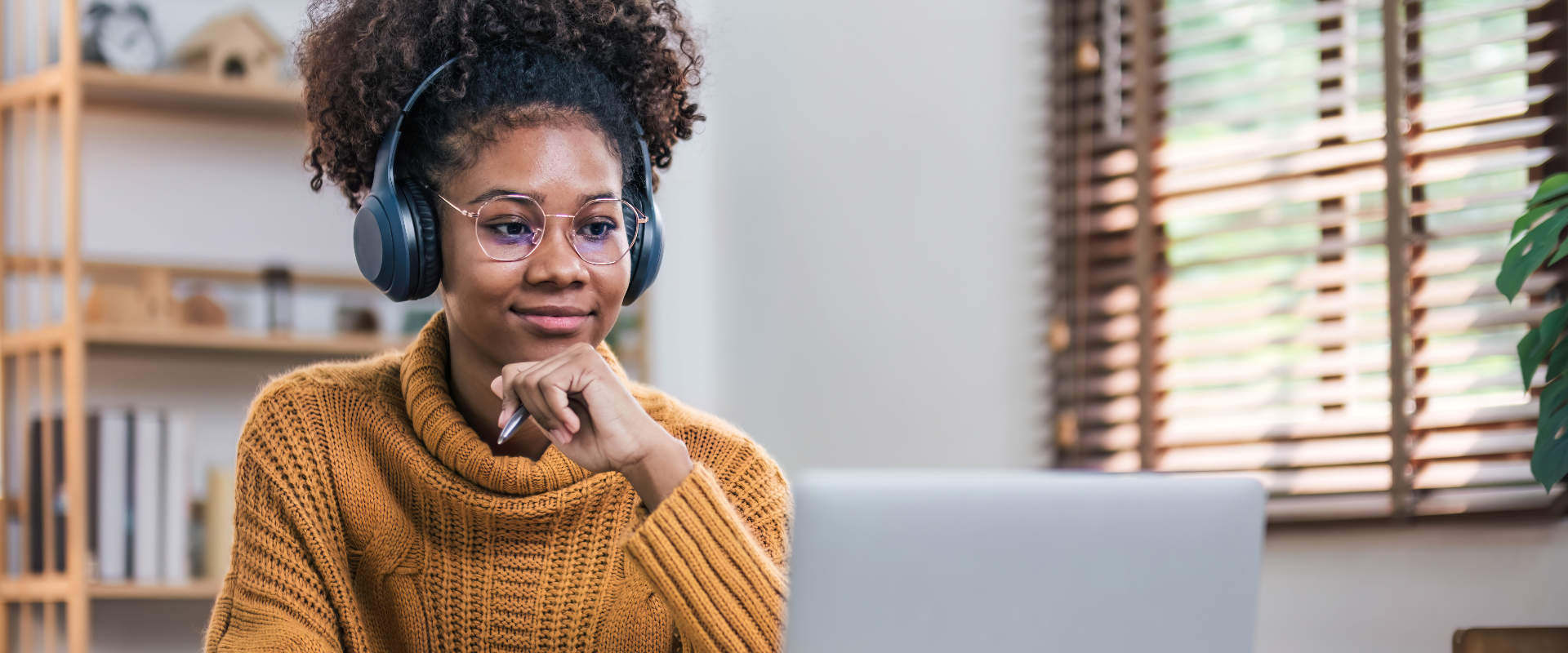 Woman watching live stream with headphones